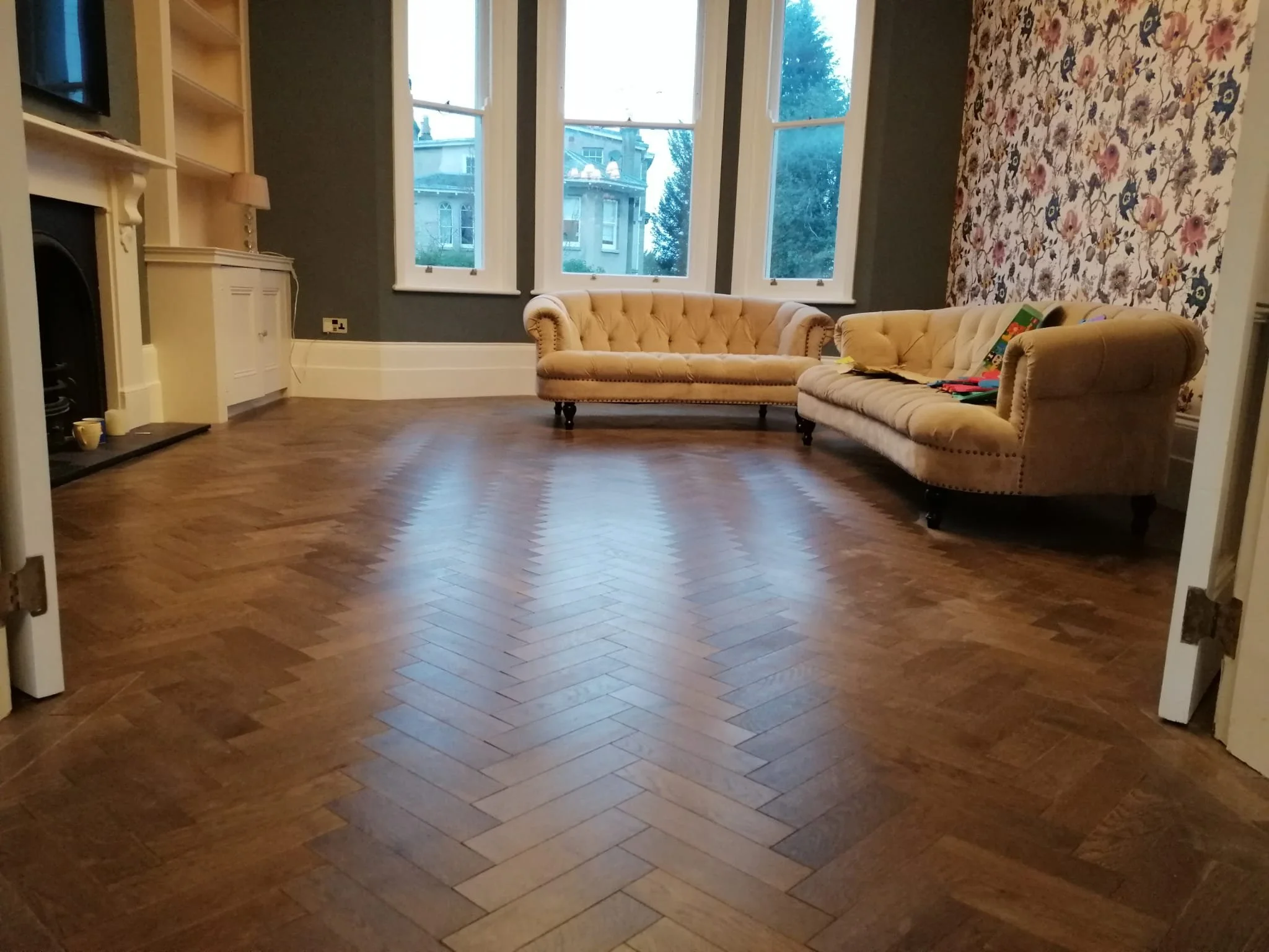 Parquet flooring in a large lounge.