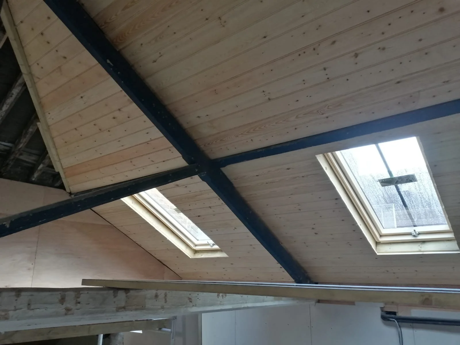 Rafters inside a wooden roof.